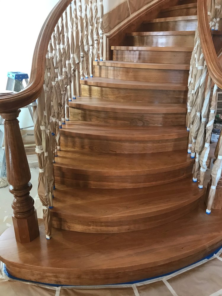 Refinished wood stair treads and painted balusters